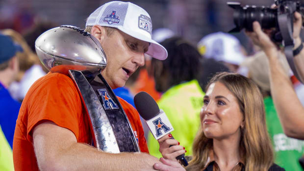 Ponies coach Rhett Lashlee with trophy after downing Tulane